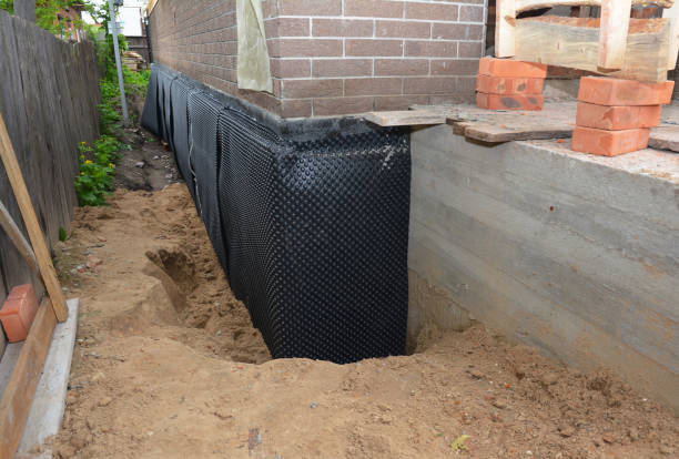 SJ Waterproofing Pros technician performing targeted Waterproofing assessment in Pulaski, NY